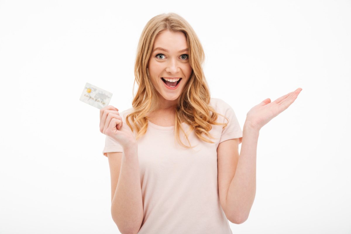 A Woman really happy using the CIBC Air Canada AC Conversion Visa Prepaid card.