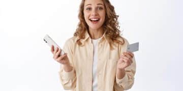 Woman using a a Tangerine World mastercard credit card.