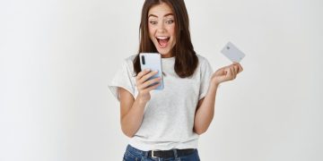A girl really happy with her Neo Secured Credit Card.