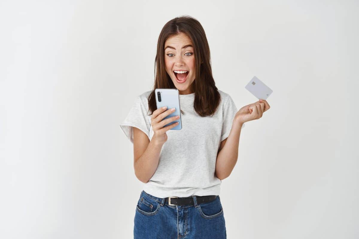 A girl really happy with her Neo Secured Credit Card.
