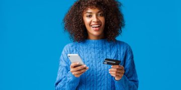 A girl using the VentureOne Rewards.
