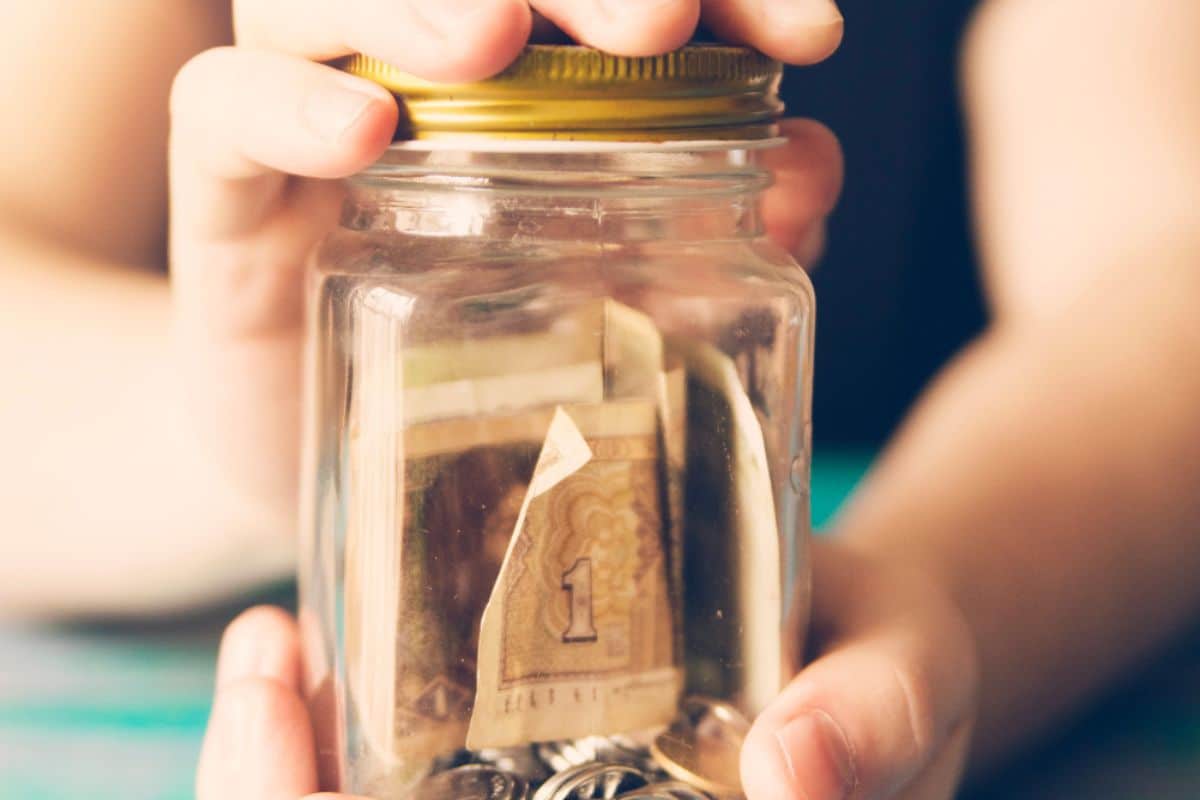 Woman separating money for emergency fund