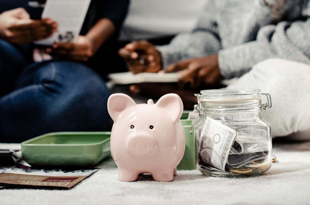 Woman and daughter separating money for emergency fund