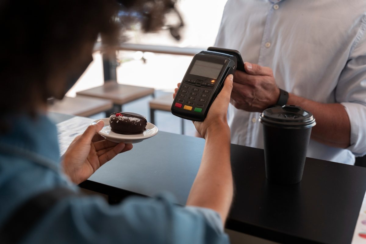 A person learning How to Use Apple Pay at store.