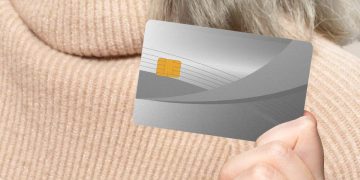 Someone holding a CareCredit Card.