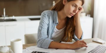 Woman learning about Debt Consolidation.