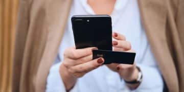 Someone holding a GM Business Card.