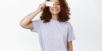 Woman holding her US Bank Cash Visa Signature.