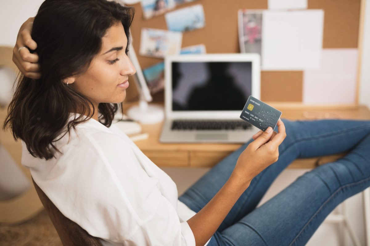 Young woman with her student bank card