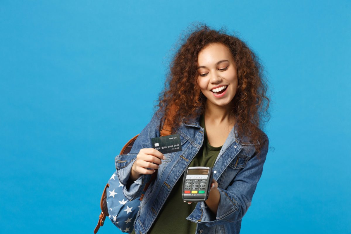 Young woman using her student bank account