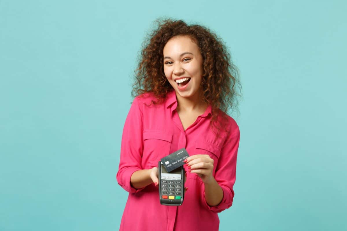 Woman using Apple Cash and Apple Card 
