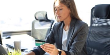 Woman learning about Co-signer on a credit card.