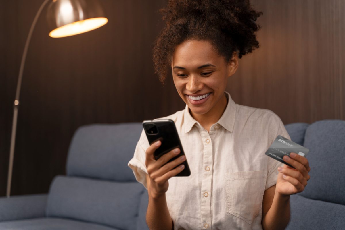 young woman opening a bank account online by phone