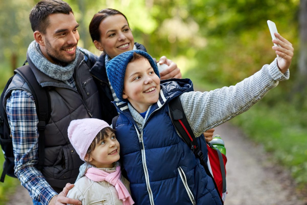 parents learning how to save money on family vacation.