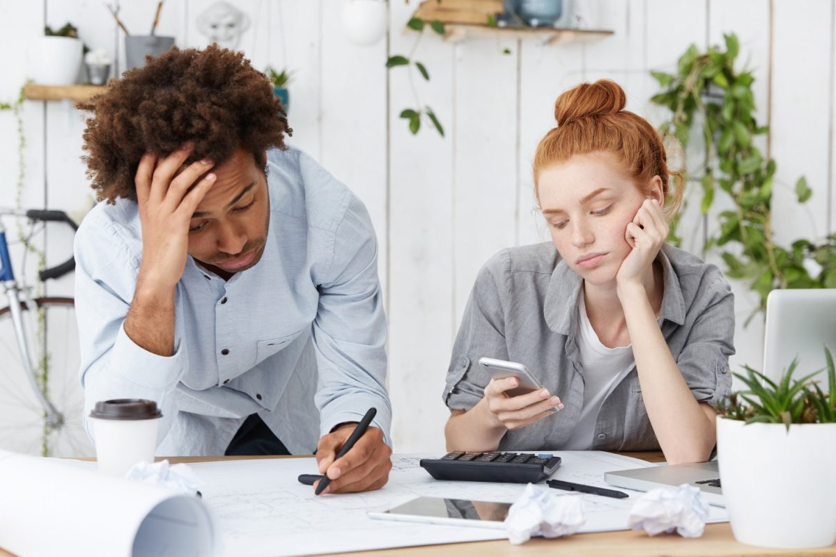 a sad couple with Credit card debt.