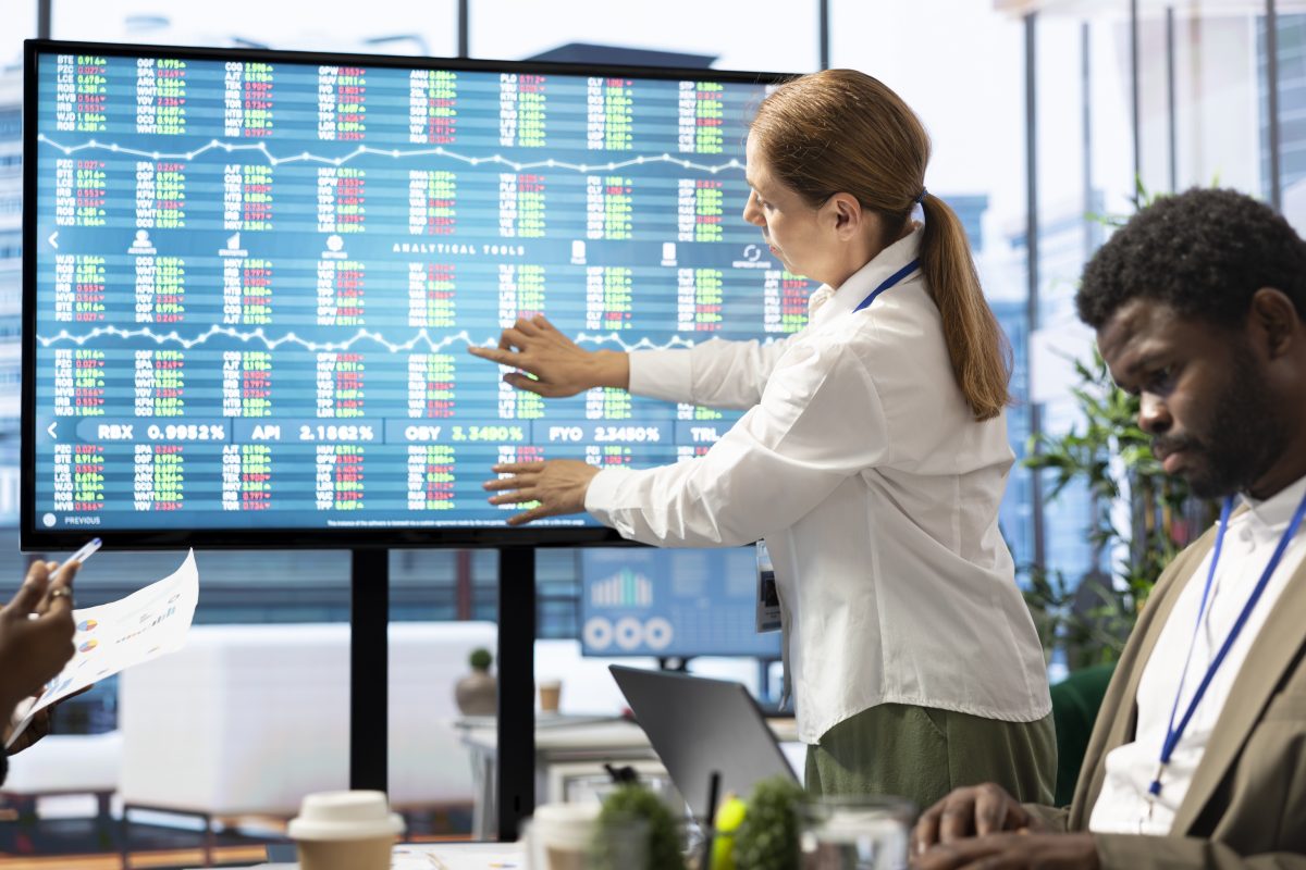 Financial professionals reviewing fintech innovation and digital financial services