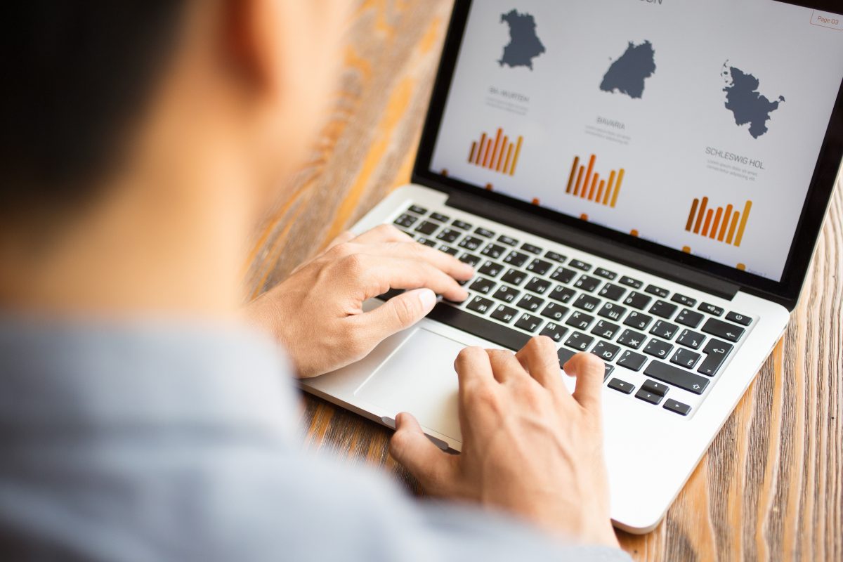 Business professional reviewing Canadian consumer spending and retail market data.